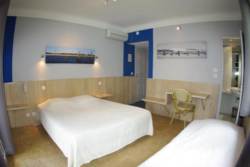 Un ou plusieurs lits dans un hébergement de l'établissement Hotel Bar Tabac Point Chaud L'Ecureuil