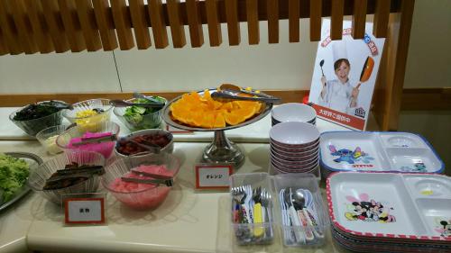 a counter top with a bunch of food on it at New Central Hotel Katsuta in Hitachinaka