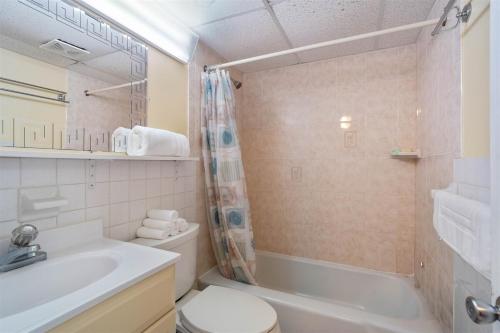 a bathroom with a sink and a toilet and a shower at Oceanfront Condo w Heated Pool & Reserved Parking in Wildwood Crest