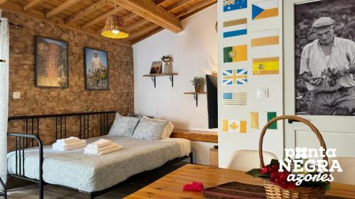 a bedroom with a bed in a room at Alojamento Ponta Negra in Biscoitos