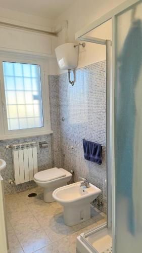 a bathroom with a toilet and a sink at b&b la terrazza in Lido dei Pini