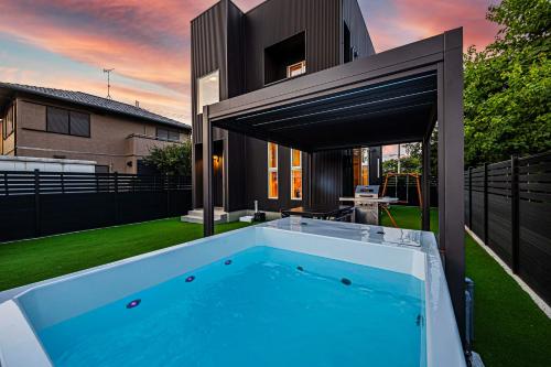 a swimming pool in the backyard of a house at Galaxy Pool Resort in Takashima