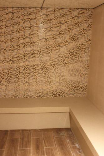 a corner of a room with a brick wall at Executives Hotel - Olaya in Riyadh