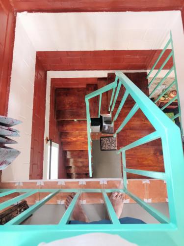 a view from inside a room with a ladder at Amaiti pool villa in Bangalore