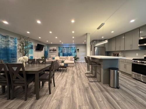 a kitchen and dining room with a table and a couch at Spacious 3 bedroom unit with backyard and parking just 10 minutes from Rodeo Dr and attractions! in Los Angeles
