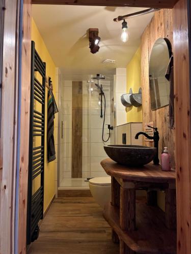 a bathroom with a sink and a toilet at Ferienhaus Hutznhaisl in Bärenstein