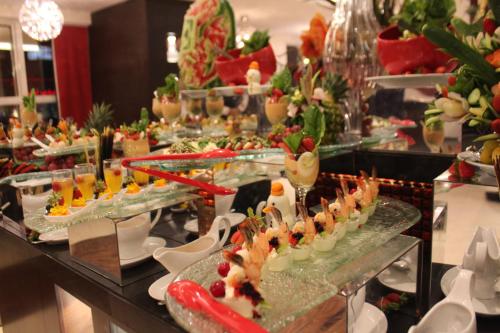 a buffet line with many different types of food at Executives Hotel - Olaya in Riyadh