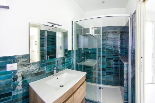 a bathroom with a sink and a shower at Villa Giannetta in Canneto