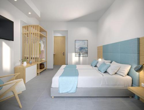 a bedroom with a large bed and a television at Poseidon Deluxe Apartments in Kos