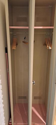 a walk in shower with a glass door at Studio calme proche de Nice in Colomars
