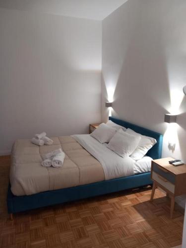 a bedroom with a bed with two towels on it at La Dolce Vita in Naples