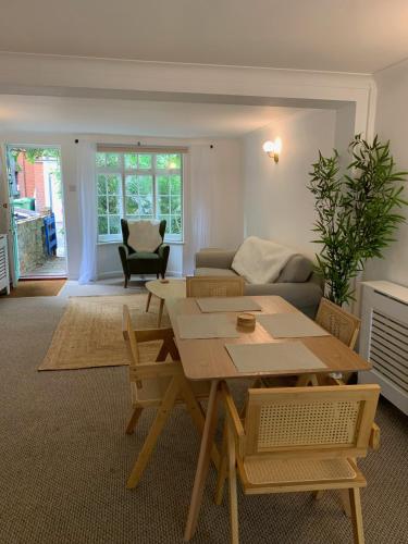 a living room with a table and a couch at Richmond Escape in Richmond upon Thames