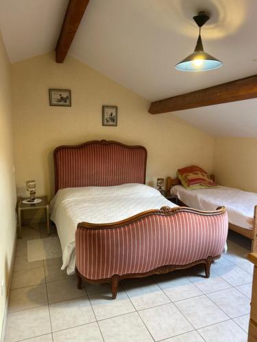 a bedroom with two beds in a room at Oxygène in Lasseube