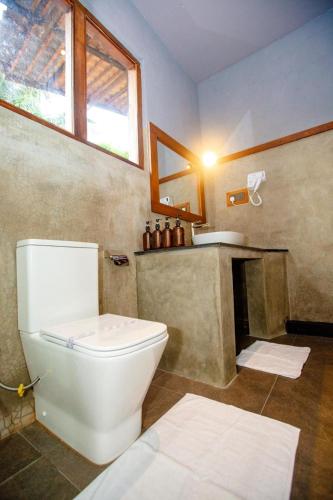a bathroom with a toilet and a sink at Viento - Habarana in Habarana