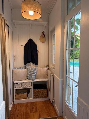 a small room with a bench in a tiny house at Large house - Garden pool in Cognac