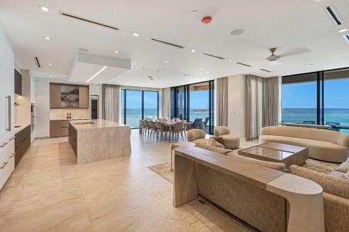 a living room with a kitchen and a dining room at AQUALINA 1101 PENTHOUSE in Nassau