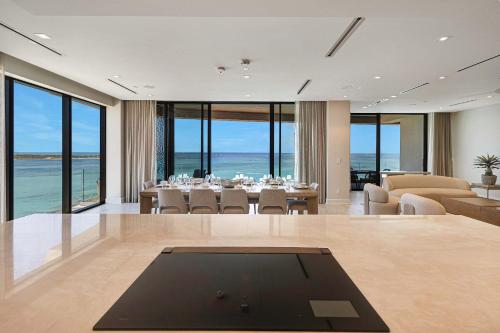 a large dining room with a table and chairs at AQUALINA 1101 PENTHOUSE in Nassau