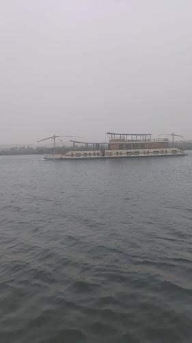 a large dock in the middle of a large body of water at Isis Hotel Nile View in Aswan