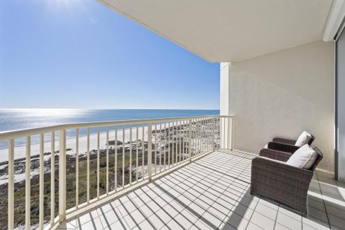 a balcony with a chair and a view of the ocean at Beach Club 1109 D in Gulf Shores