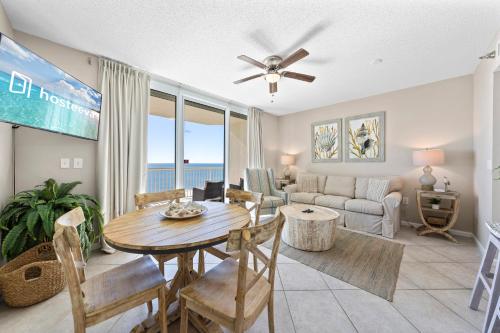a living room with a table and a couch at Beach Club 1109 D in Gulf Shores
