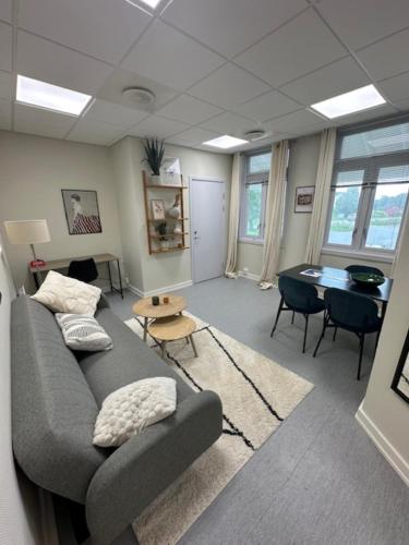a living room with a couch and a table at Åsen Apartment, Stamsund in Stamsund