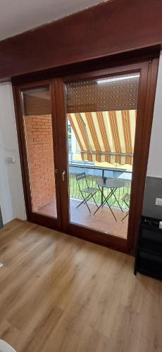 a sliding glass door with a view of a patio at MarcOrio Apartment in Orio al Serio
