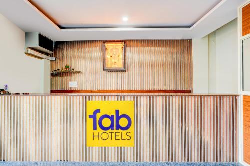 a sign on the wall of a hotel at FabHotel Royal Garuda Palace in Bangalore