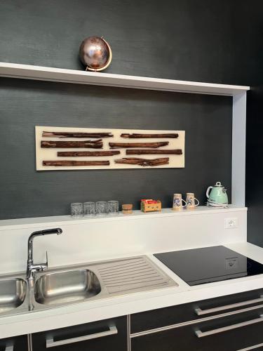 a kitchen with a sink and a counter top at B&B Dai Toscans in Cividale del Friuli