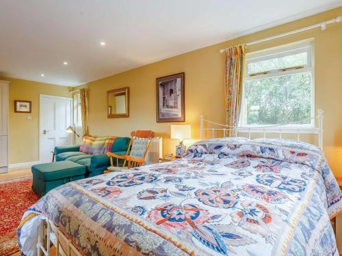 a bedroom with a bed and a living room at 1 Bed in Ardgay oc-89058 in Culrain