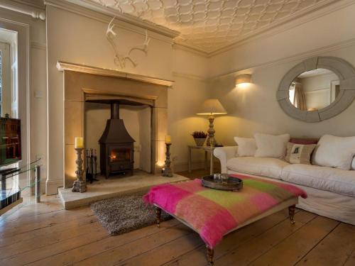 a living room with a couch and a fireplace at 2 Bed in Grange Over Sands oc-lcc01 in Grange Over Sands