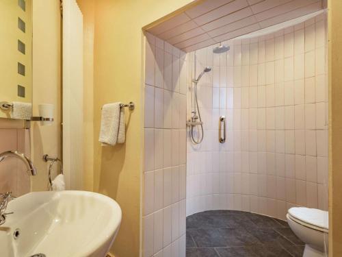 a bathroom with a shower and a sink and a toilet at 1 Bed in Crieff oc-87497 in Crieff