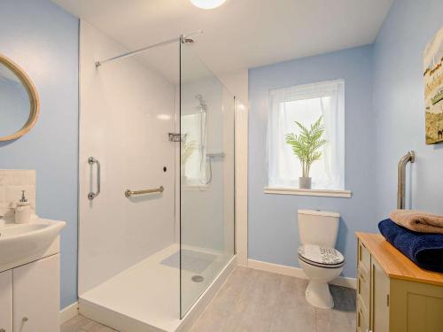 a bathroom with a glass shower with a toilet at 2 Bed in Bonnybridge oc-90602 in Bonnybridge