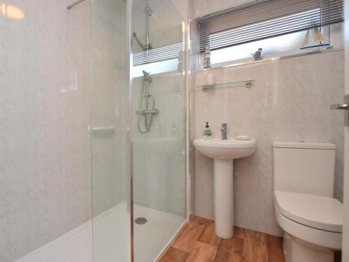 a bathroom with a shower and a toilet and a sink at 3 Bed in Galashiels oc-76698 in Galashiels