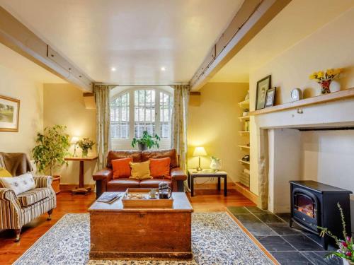a living room with a couch and a fireplace at 1 Bed in Crieff oc-87498 in Crieff