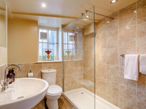 a bathroom with a tub and a toilet and a sink at 1 Bed in Crieff oc-87498 in Crieff