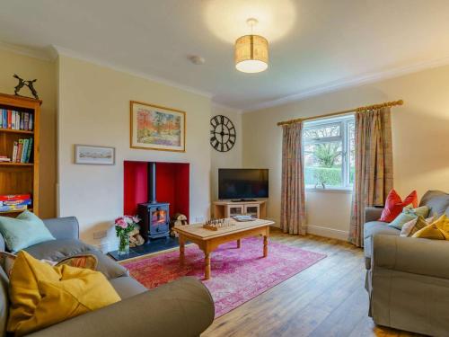 a living room with a couch and a coffee table at 3 Bed in Blairgowrie oc-90111 in Blairgowrie