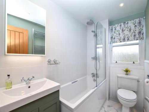 a white bathroom with a sink and a toilet at 2 Bed in Anstruther oc-80648 in Pittenweem