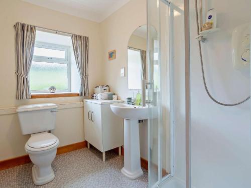 a bathroom with a toilet and a sink and a shower at 1 Bed in Beauly oc-82778 in Beauly