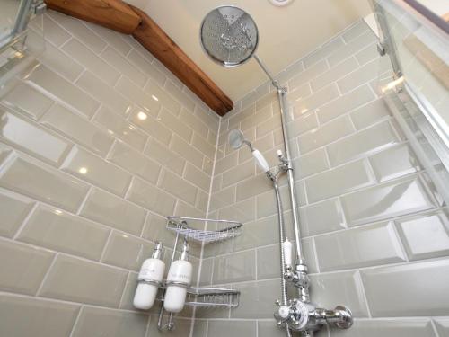 a bathroom with a shower with white tiles at 2 Bed in West Linton oc-76383 in West Linton