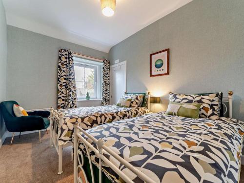 a bedroom with two beds and a window at 2 Bed in Maybole oc-96012 in Maybole