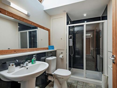 a bathroom with a toilet and a sink and a shower at 1 Bed in Castle Douglas oc-ca371 in Castle Douglas