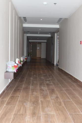 an empty hallway with wooden floors in a building at Executives Hotel - Olaya in Riyadh