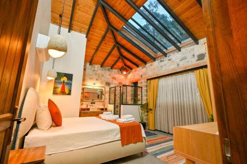 a bedroom with two beds in a room with a window at Villa Skylight Göcek Fethiye in Fethiye