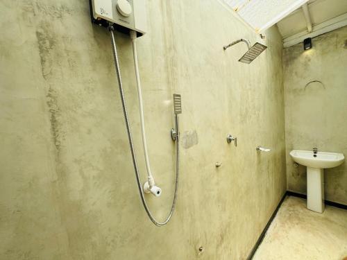 a bathroom with a shower and a sink at Hotel Lean at 83 in Ahangama