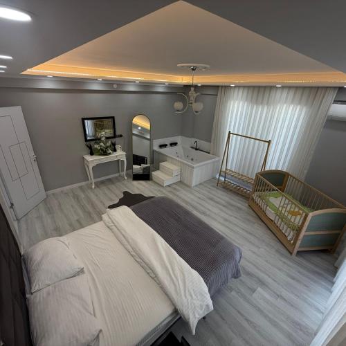 a bedroom with a large bed and a bath tub at Begonvil Konaklama in Sapanca