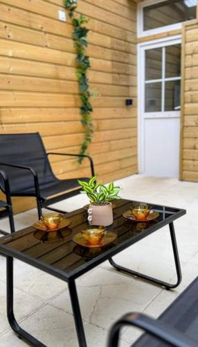 a patio table with two plates of food on it at Cocon détente & Jacuzzi(Balnéo) in Dieppe