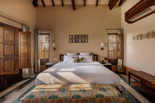 a bedroom with a large bed in a room at Forsté Arcangela, Sangolda in Sangolda