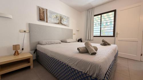 a bedroom with a bed with two pillows on it at Casa di Luca EL VERGEL by luca properties gran canaria in Puerto Rico de Gran Canaria