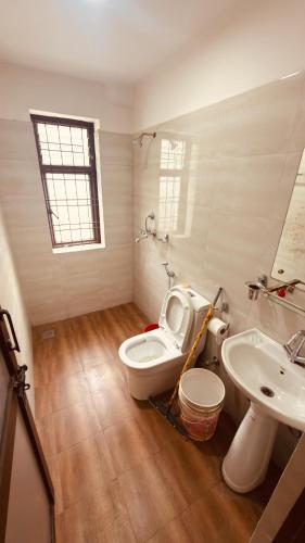 a bathroom with a toilet and a sink at Pharping StayInn in Pharping
