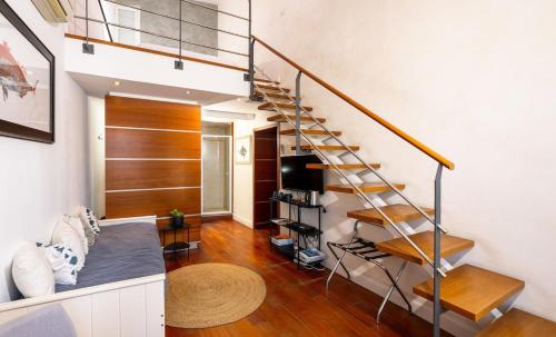 a living room with a staircase in a house at Le Mistral par Dodo-a-Cassis in Cassis